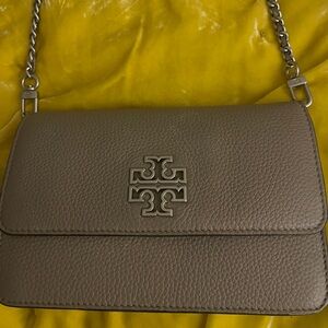 Tory Burch Britten Chain Wallet, often in French Grey pebbled leather